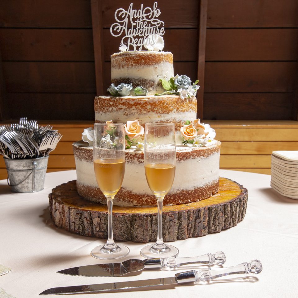 Wedding Cake & champagne glasses Sky island photography John Heyward