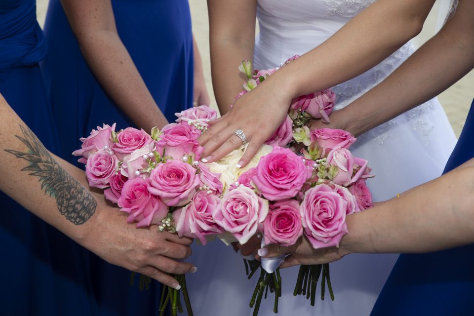 Bridal Party Flower Bouquets with brides hand and wedding ring Sky Island Photography John Heyward